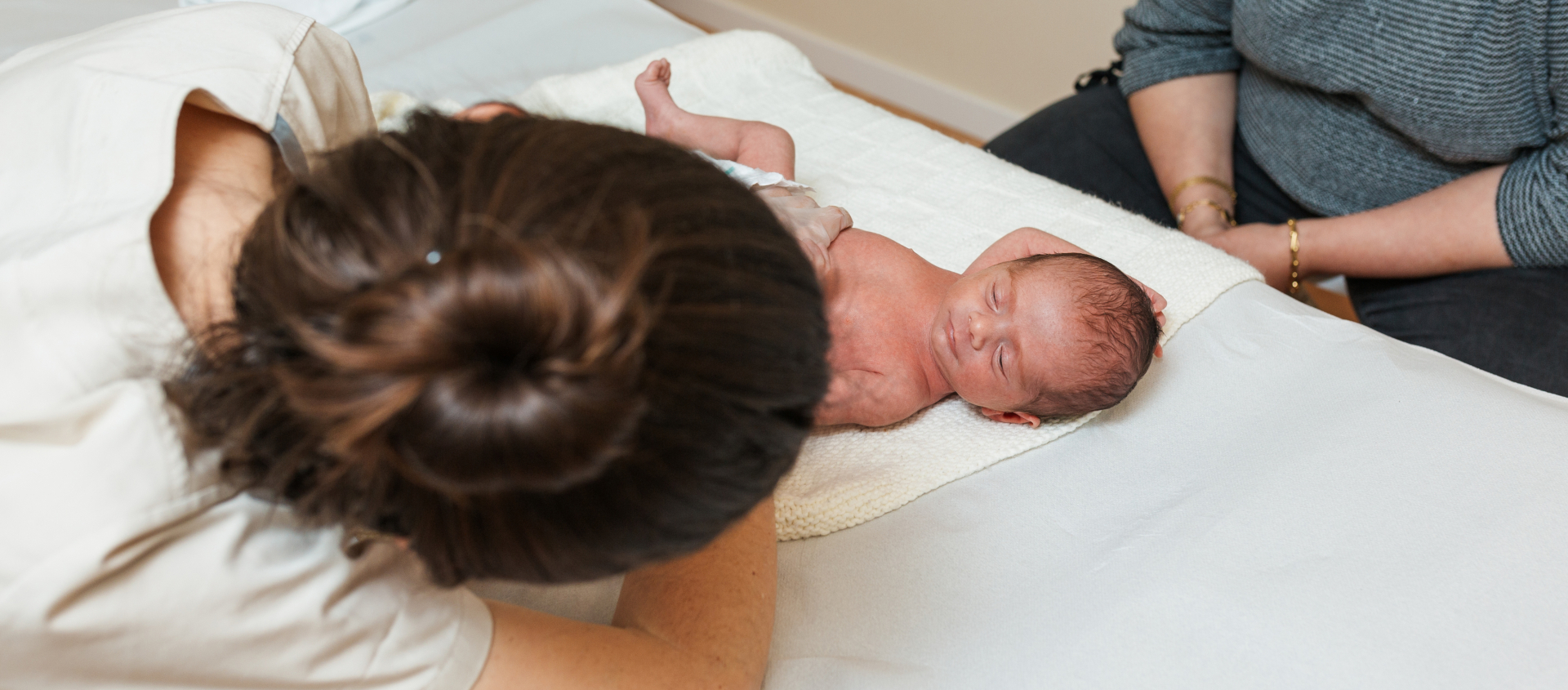Women looking at baby