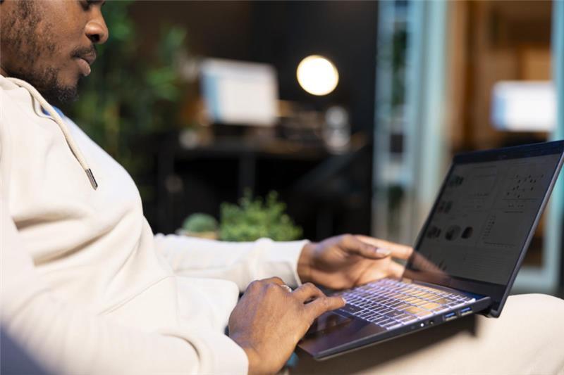 man doing research on a laptop