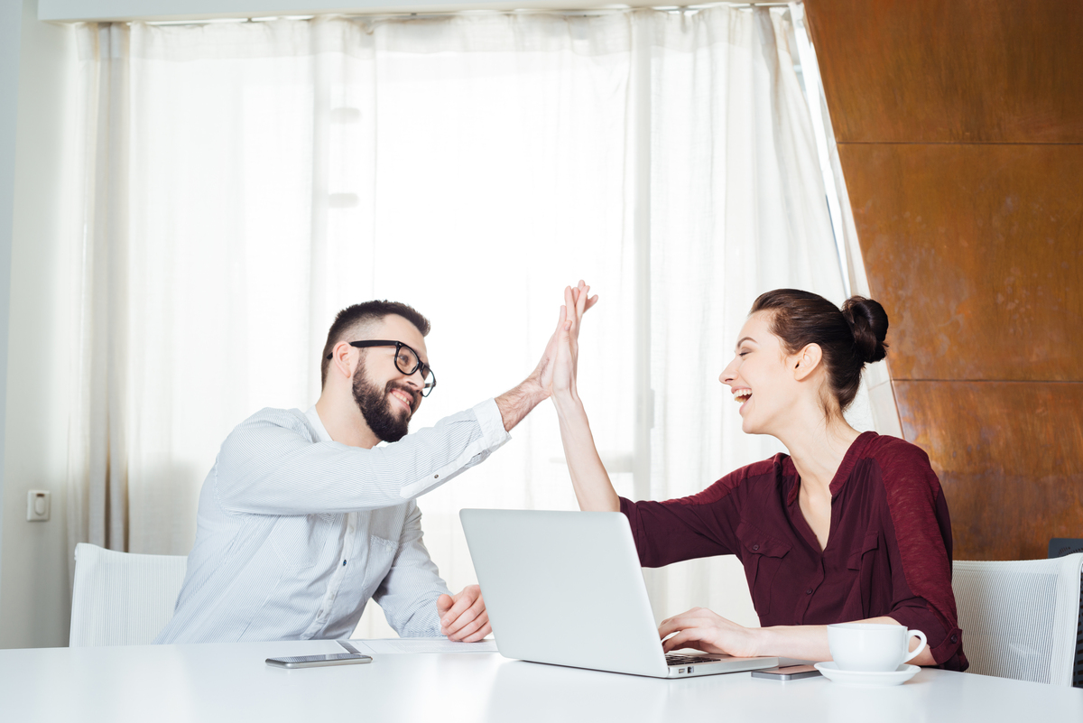 two business people high-fiving