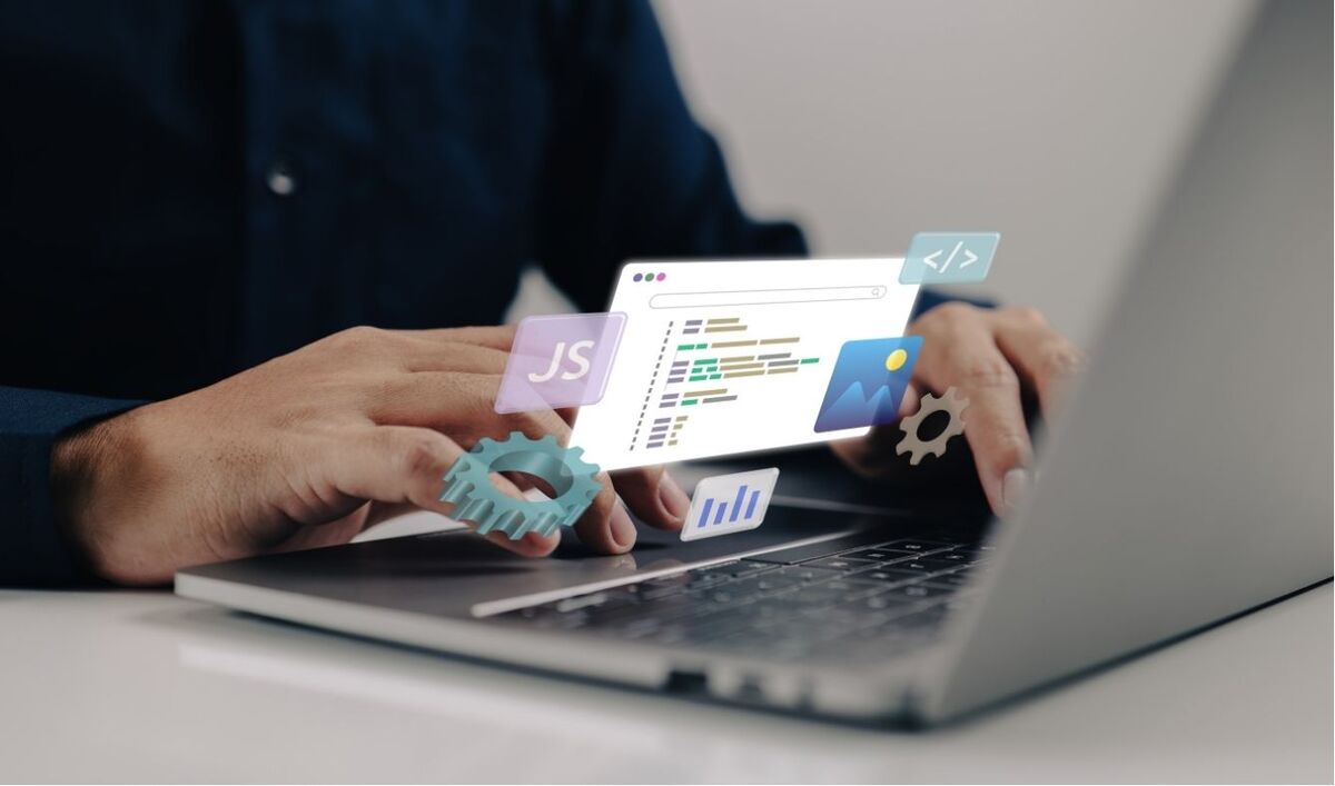 hands typing on a laptop computer