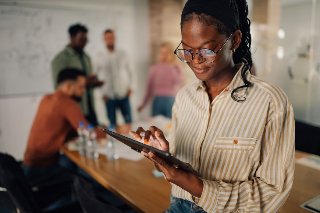 young manager using a tablet at her place of business
